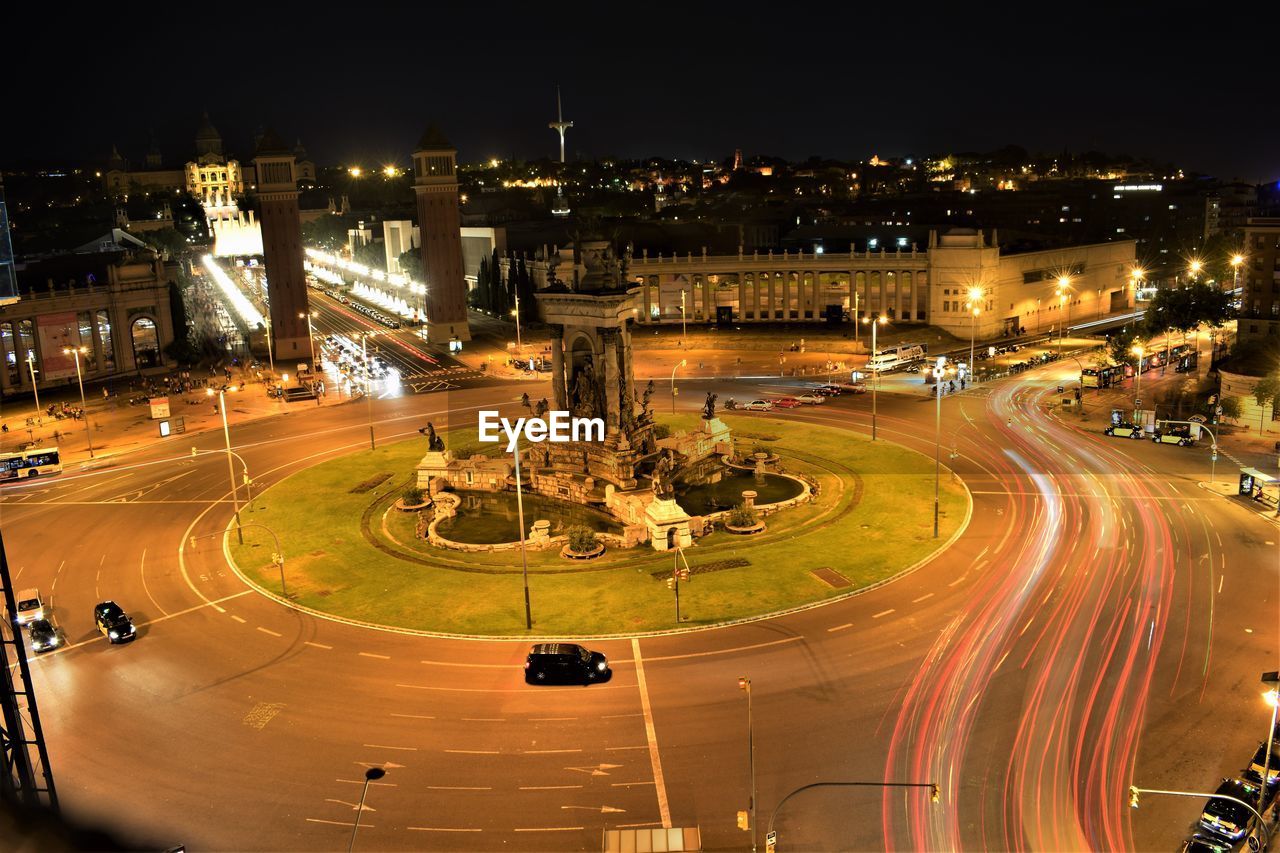 HIGH ANGLE VIEW OF LIGHT TRAILS ON ROAD IN CITY