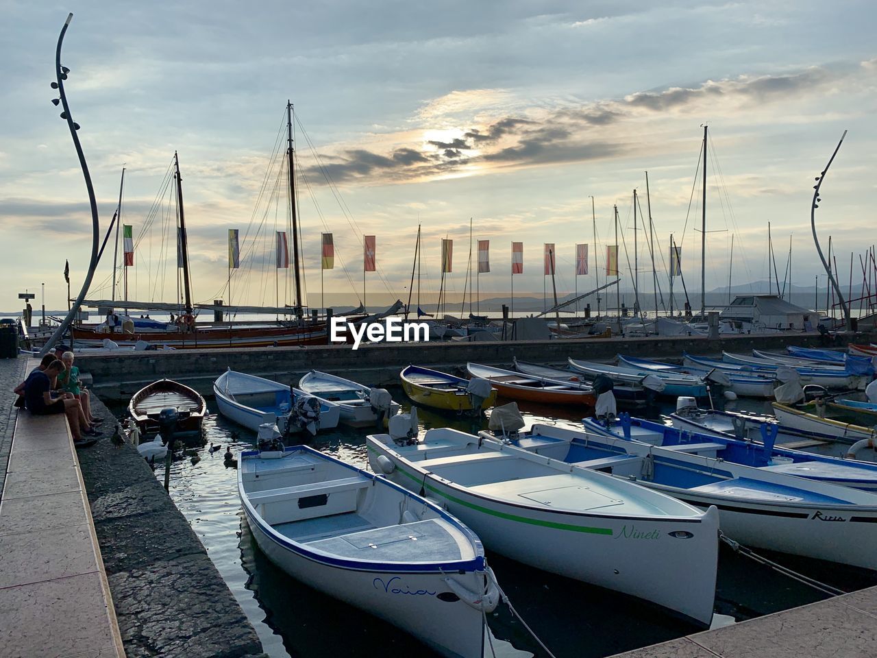 BOATS MOORED AT HARBOR