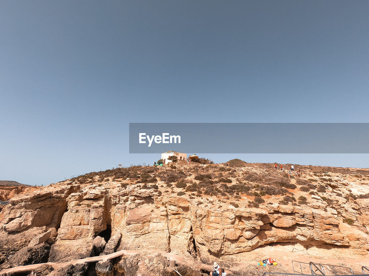 LOW ANGLE VIEW OF ROCK FORMATION AGAINST SKY