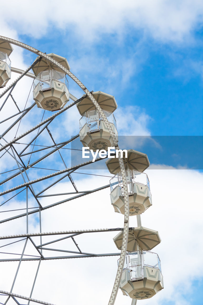 low angle view of electricity pylon against cloudy sky