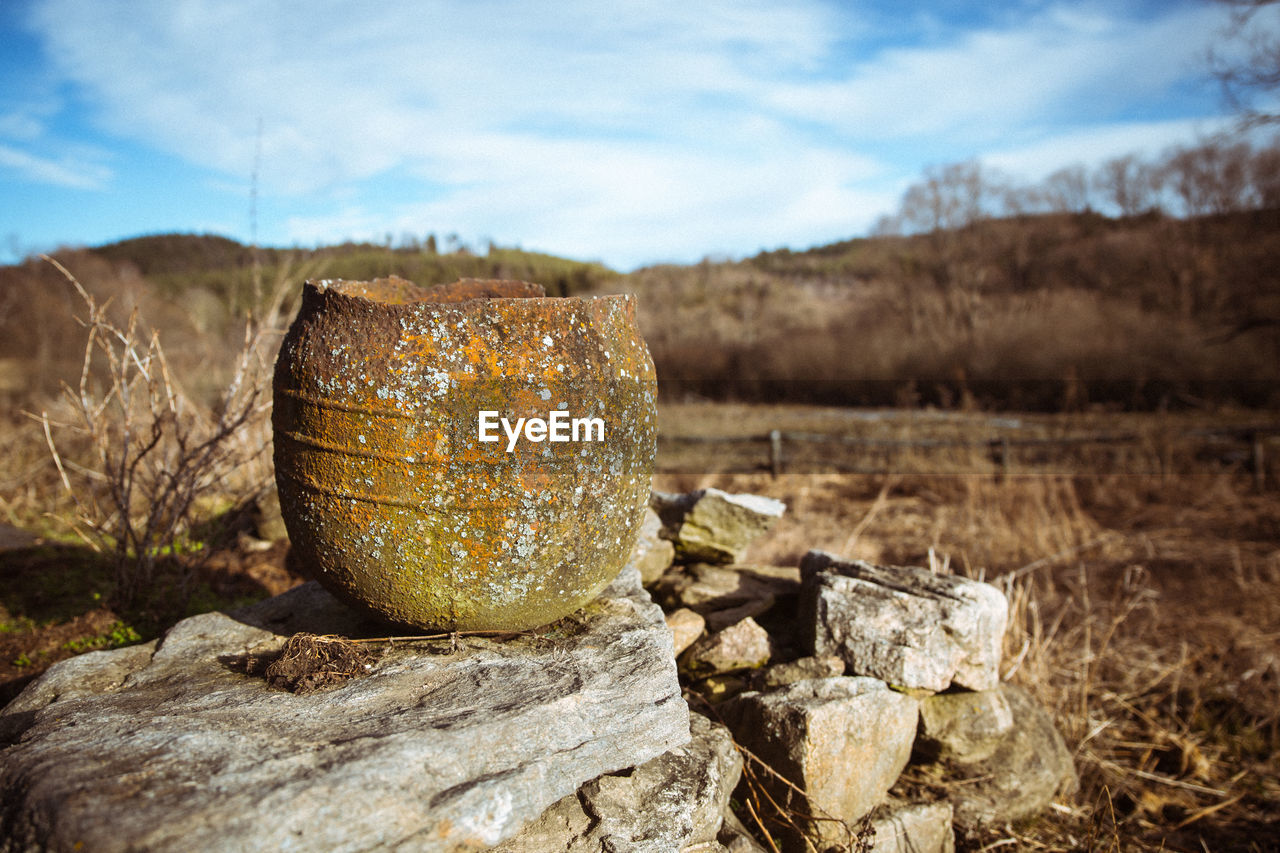 STACK OF ROCKS ON FIELD