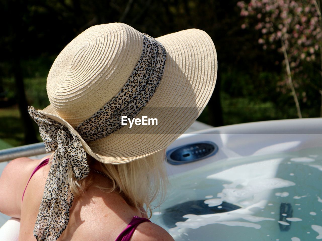 Close-up of woman wearing sun hat