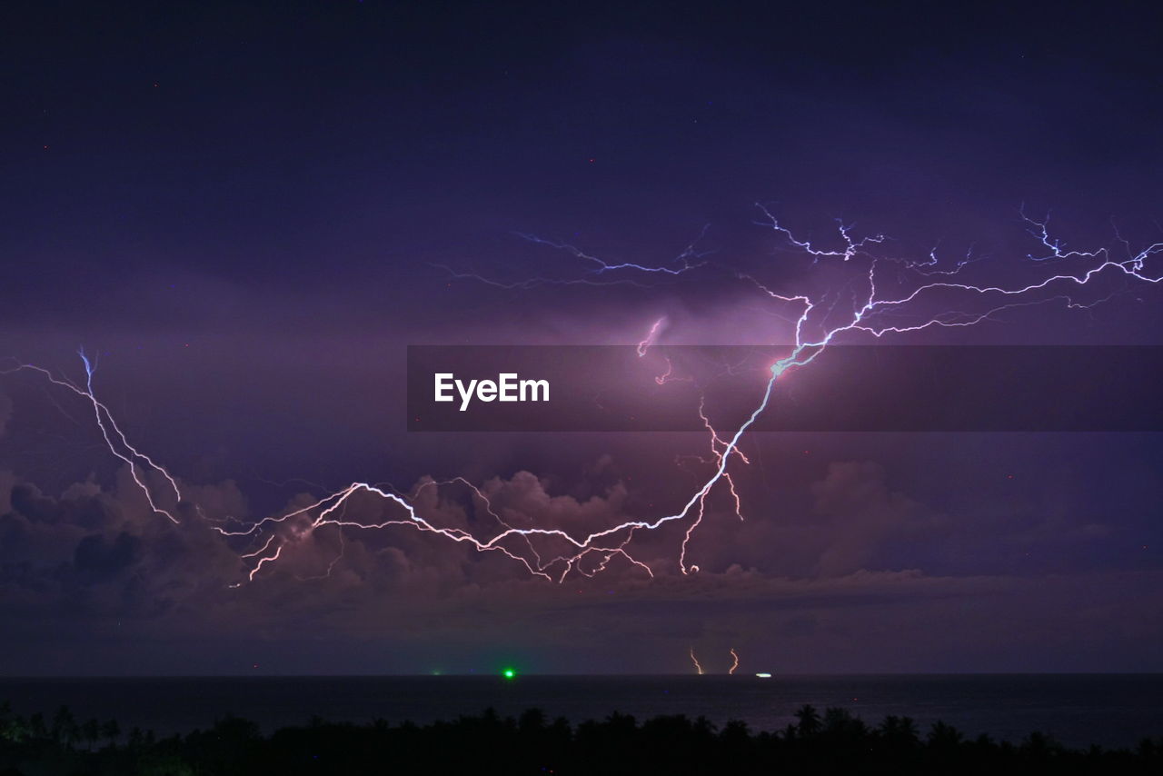 Scenic view of lightning in sky at night