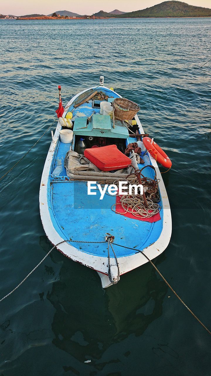 High angle view of fishing boat moored in lake