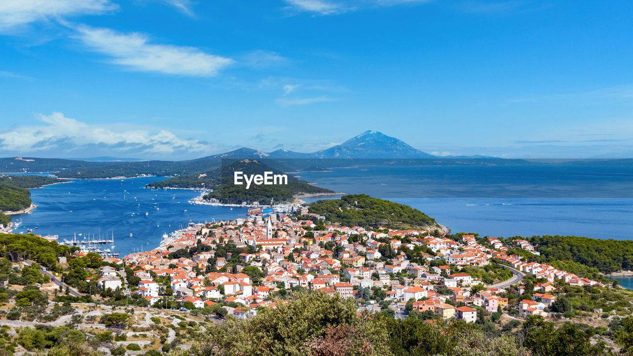 Panoramic postcard view of a seaside town on an island. mali losinj, croatia.