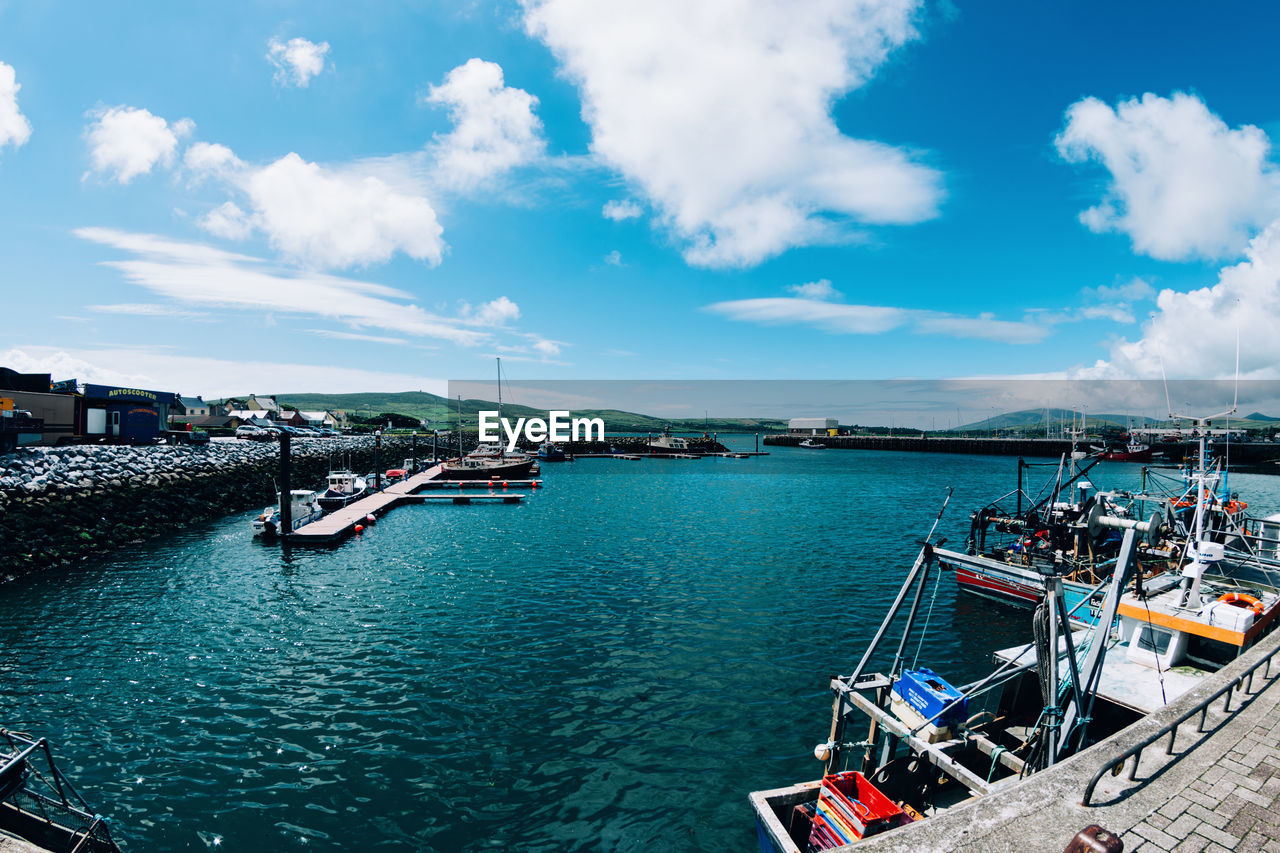 High angle view of boats moored at harbor