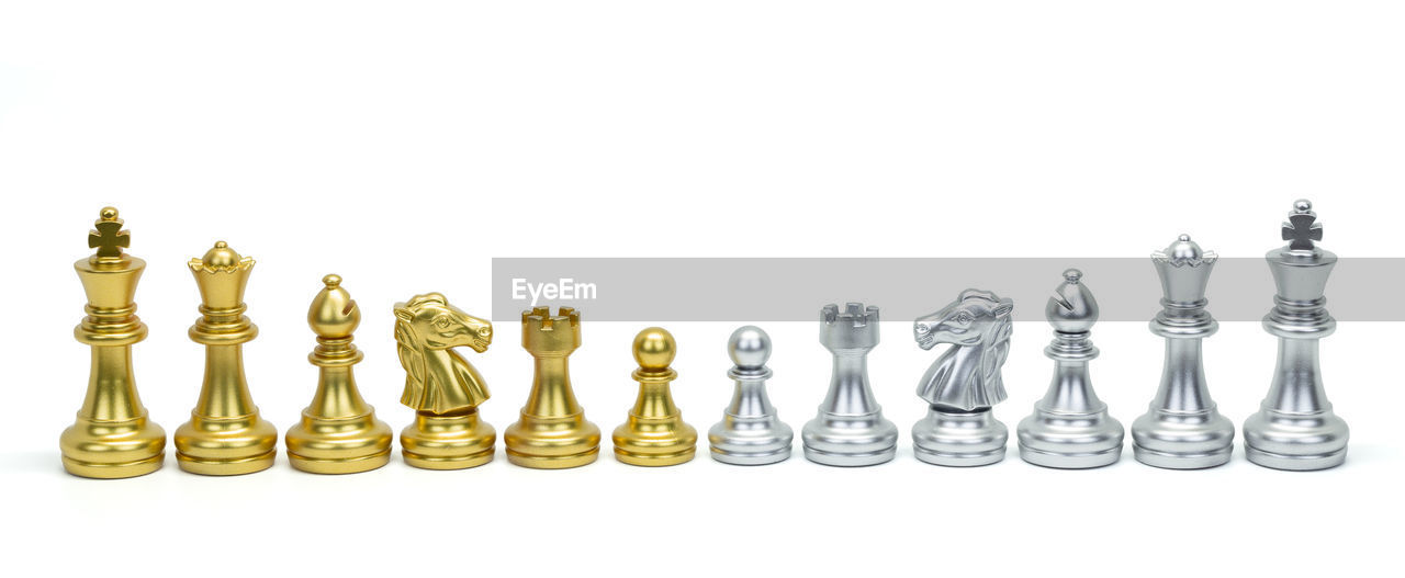 LOW ANGLE VIEW OF CHESS PIECES ON TABLE
