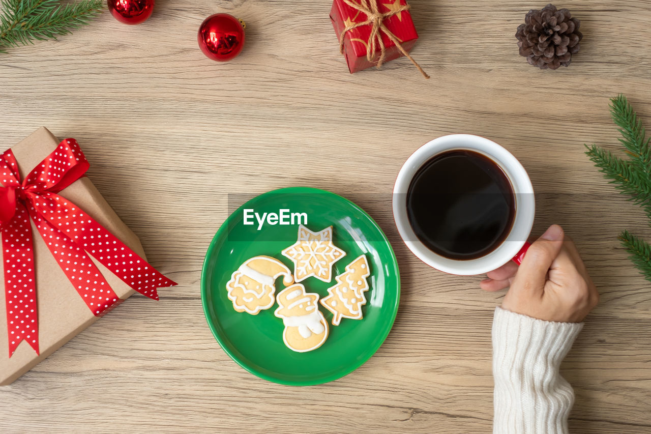 HIGH ANGLE VIEW OF COFFEE CUP ON TABLE WITH SPOON