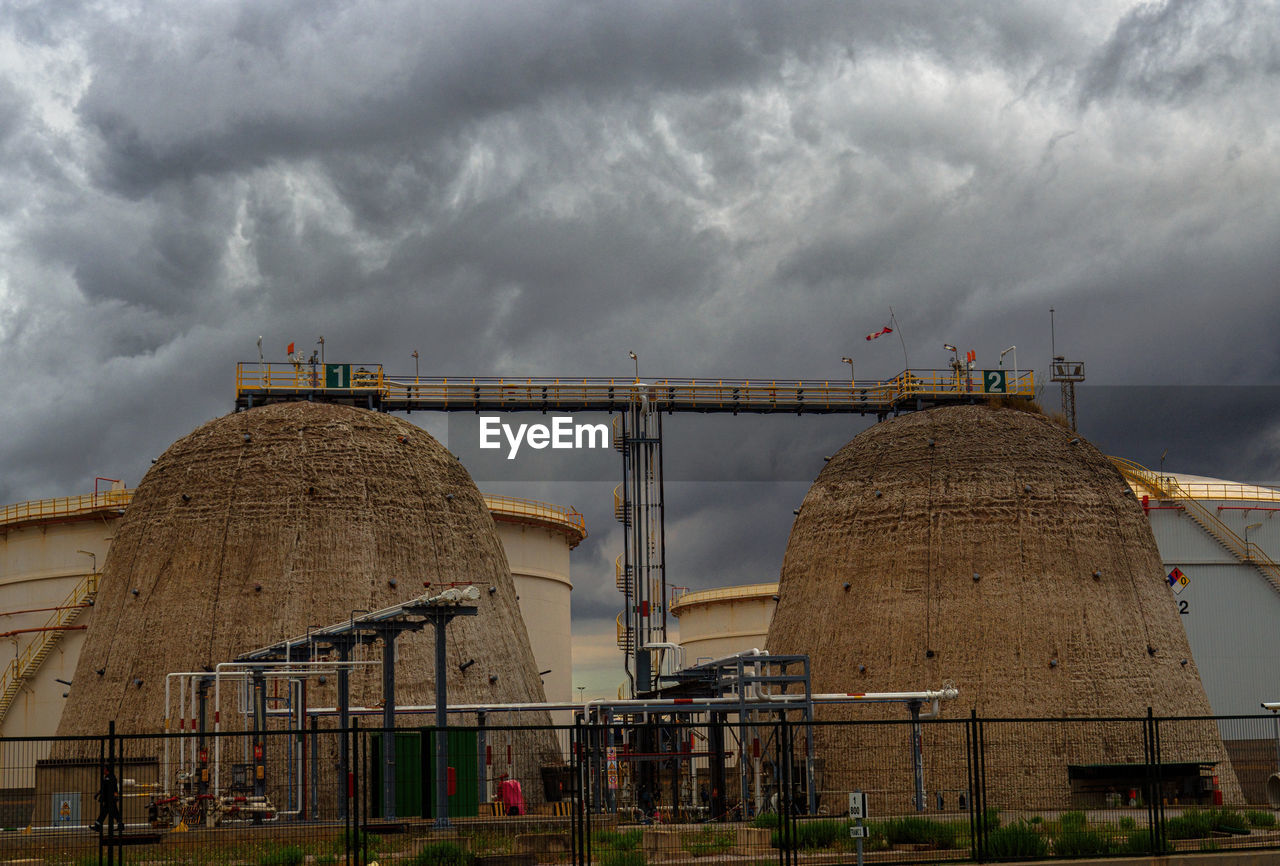 Low angle view of building against cloudy sky