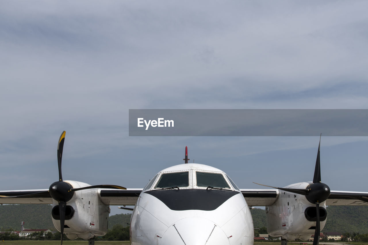 Airplane against sky