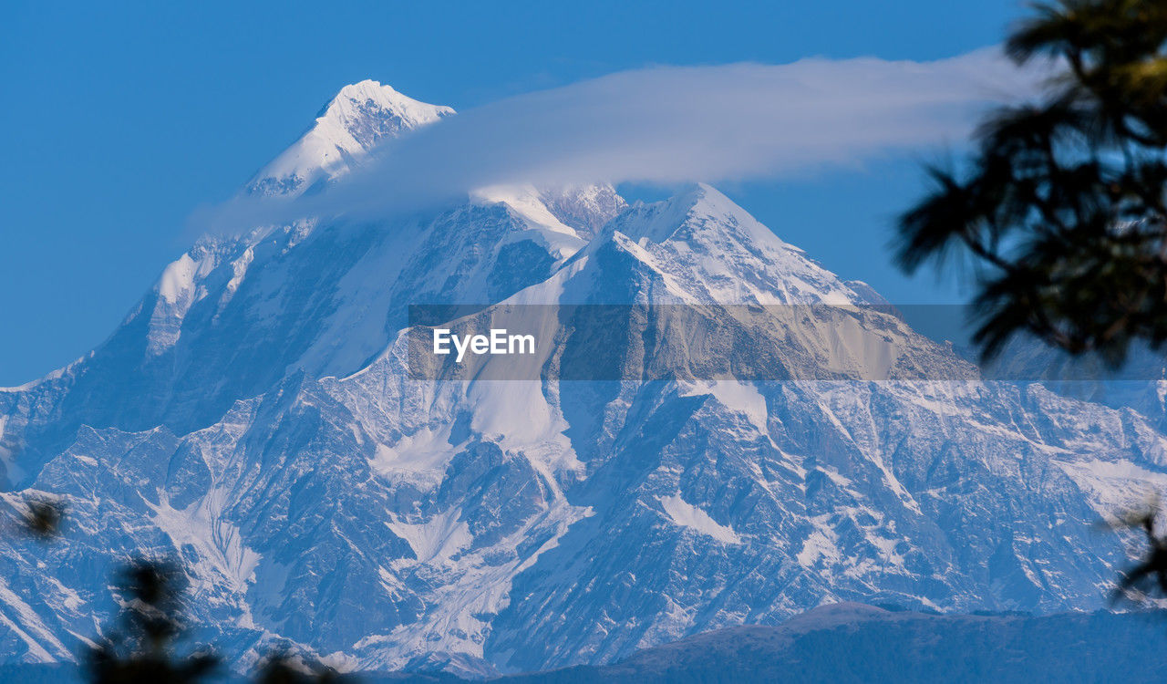 snow, cold temperature, winter, mountain, scenics - nature, beauty in nature, environment, snowcapped mountain, mountain range, sky, landscape, nature, blue, mountain peak, no people, ice, travel destinations, tree, tranquil scene, tranquility, outdoors, frozen, travel, plant, day, land, non-urban scene