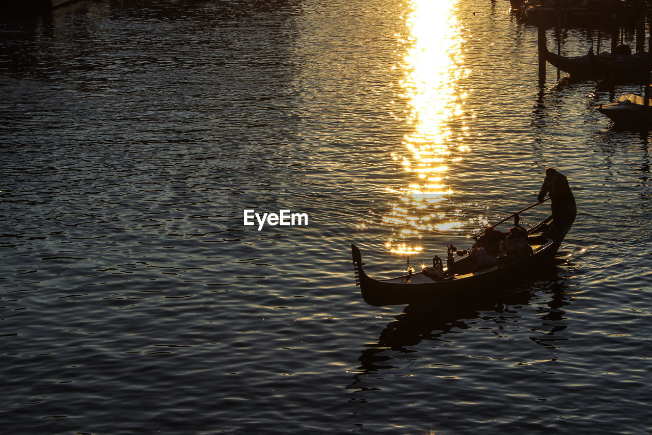 BOAT IN SEA DURING SUNSET