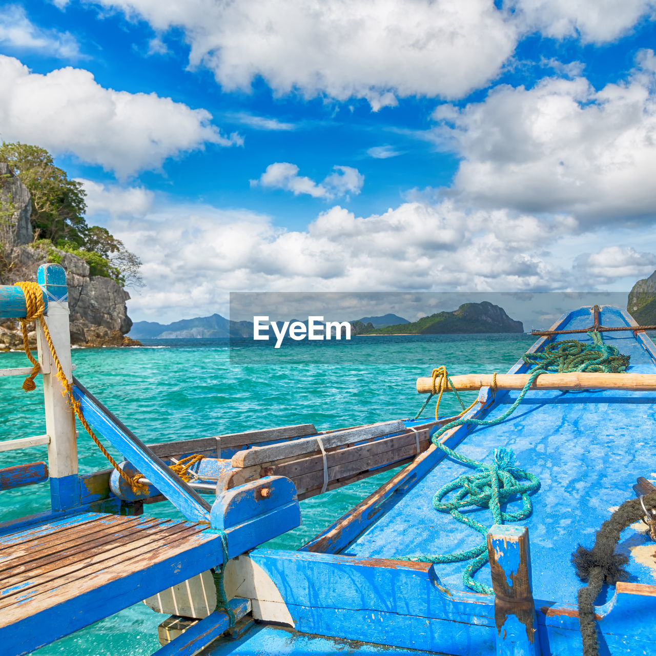 FISHING BOAT IN SEA AGAINST SKY