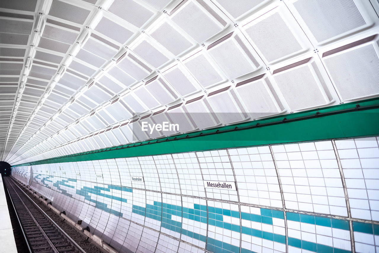 LOW ANGLE VIEW OF RAILROAD STATION PLATFORM