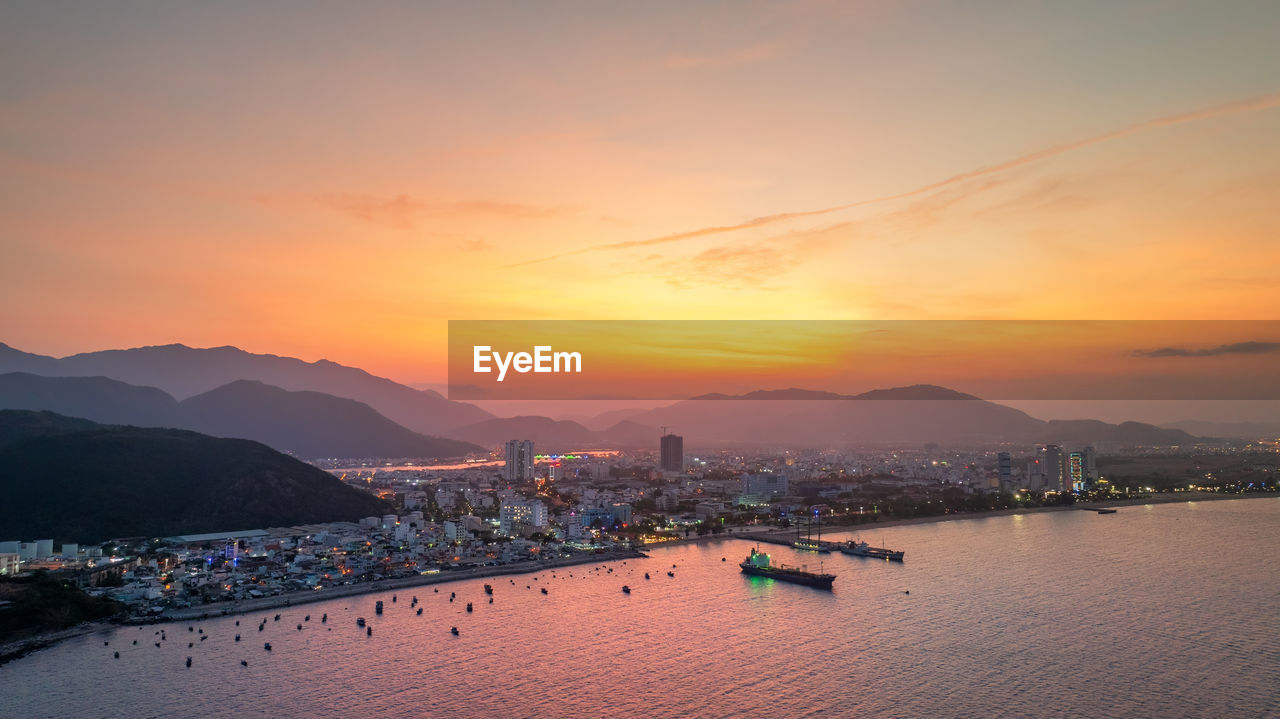 high angle view of sea against sky during sunset