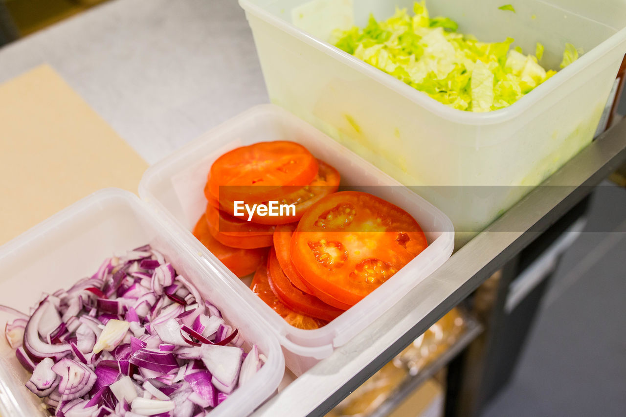 High angle view of chopped vegetables in bowl on table