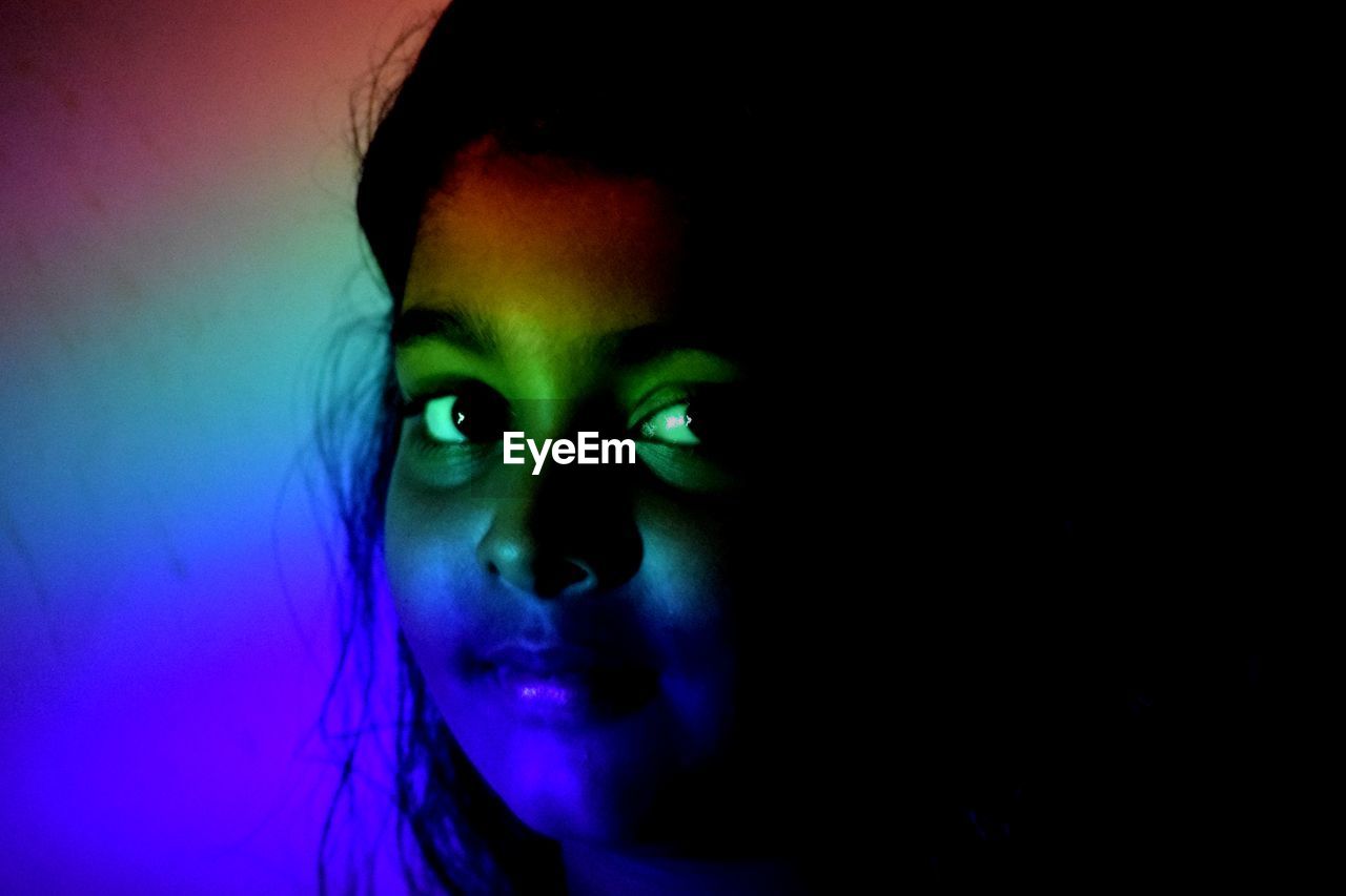 Close-up portrait of girl with spectrum