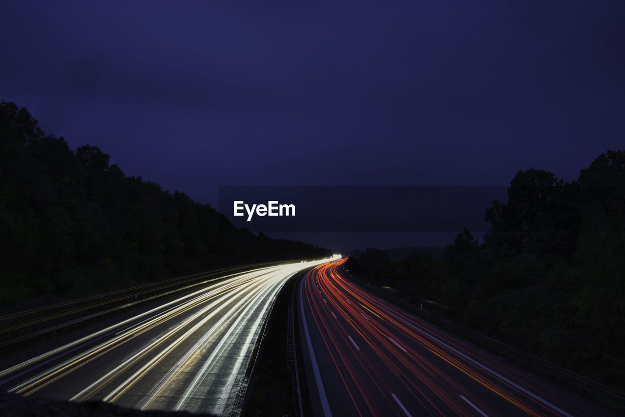 LIGHT TRAILS ON HIGHWAY