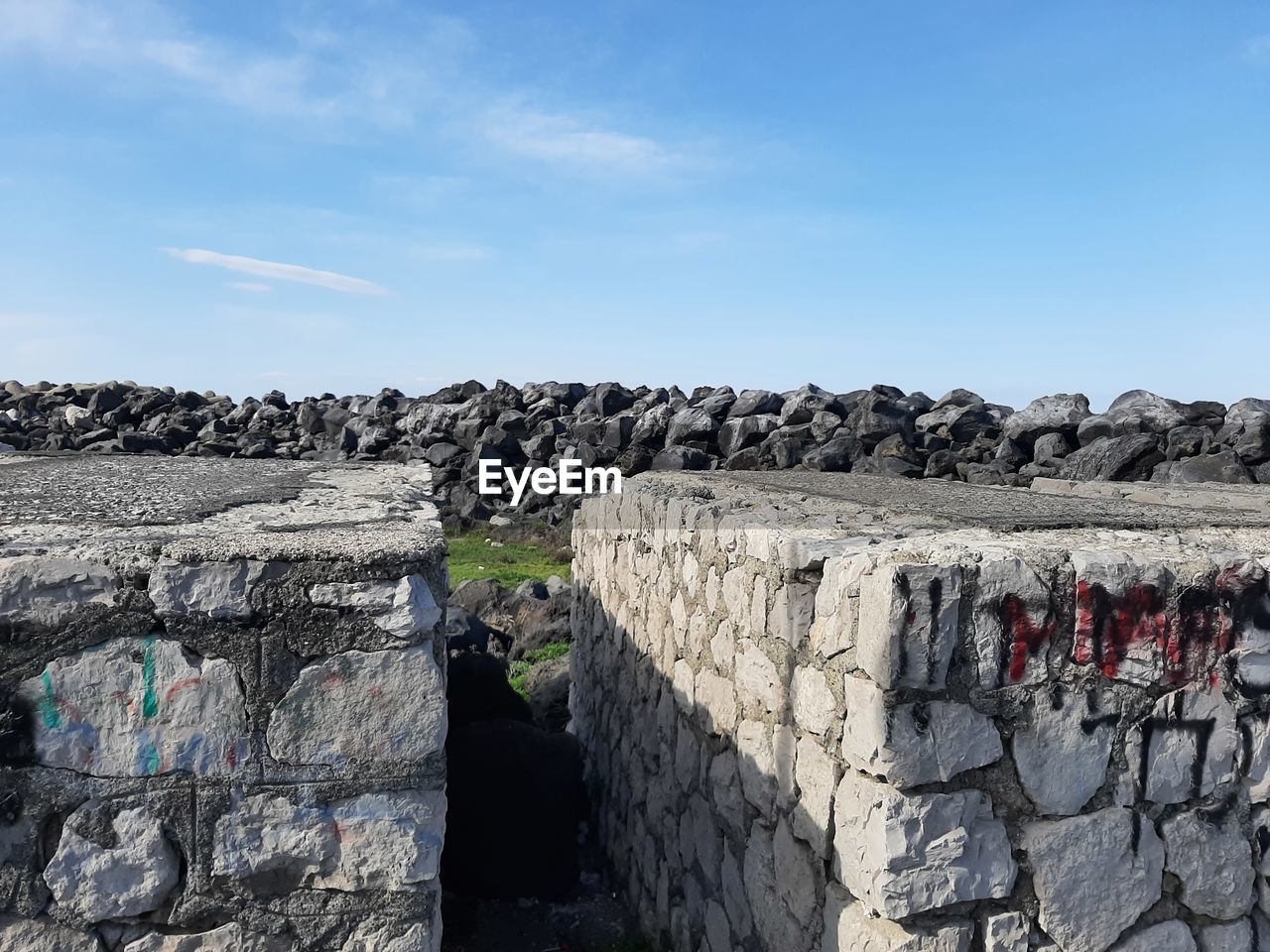 Low angle view of rock formations against sky