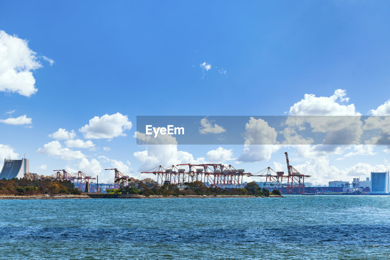 Seascape of the gantry cranes of the international container terminal in the port of tokyo.