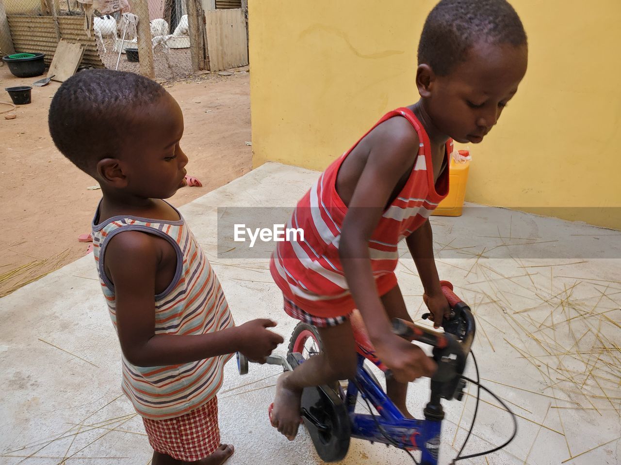 BOY RIDING BICYCLE