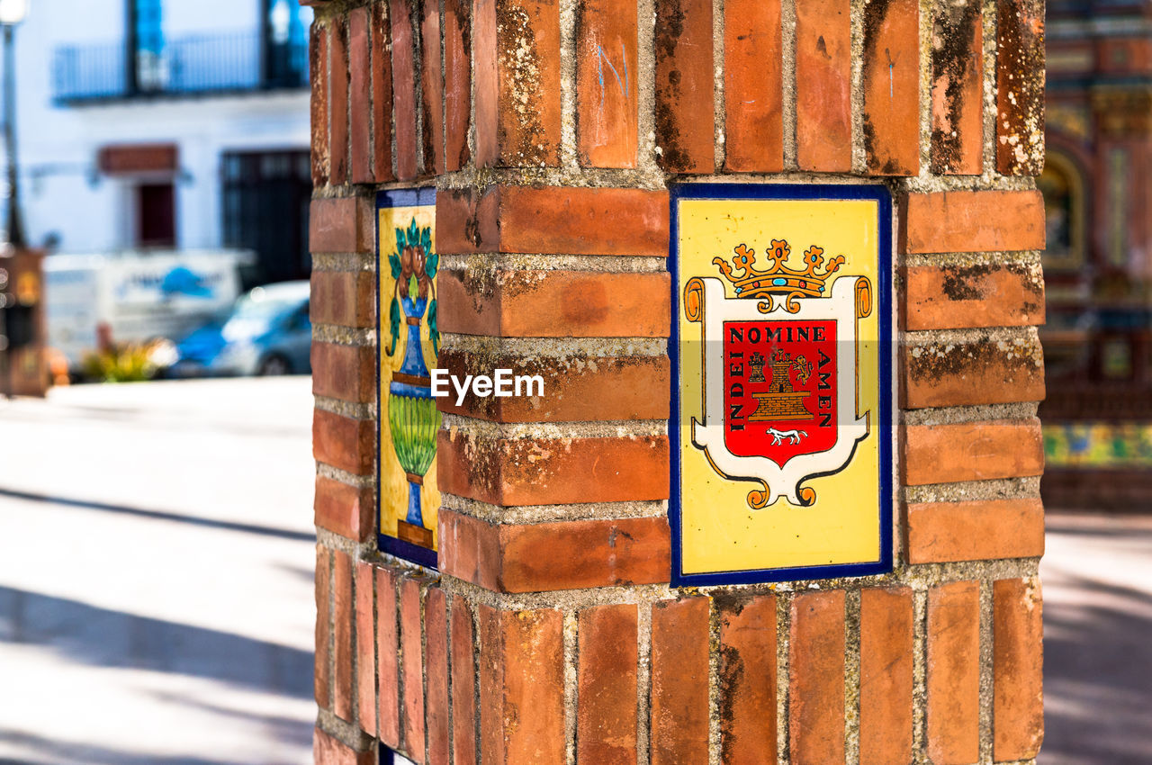 Coat of arms on brick column at vejer de la frontera