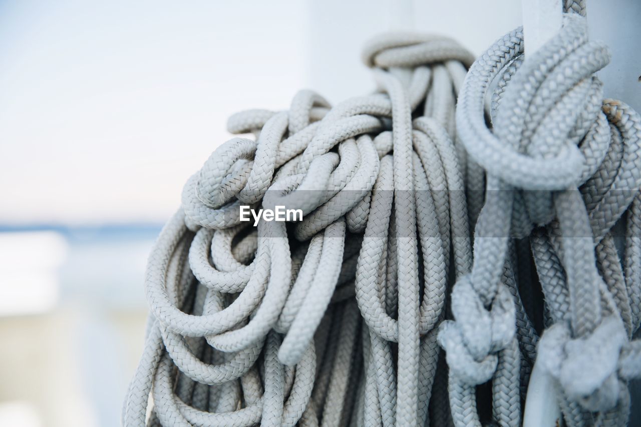 Close-up of ropes tied on pole