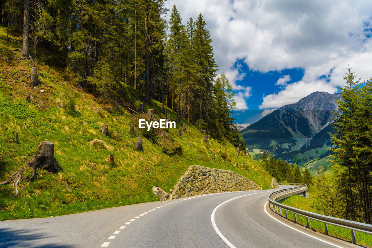 ROAD PASSING THROUGH MOUNTAINS