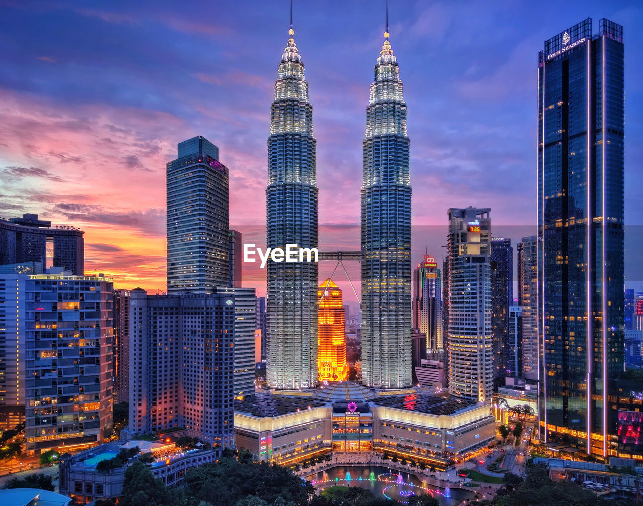 Klcc petronas twin towers with a brilliant sunset backdrop