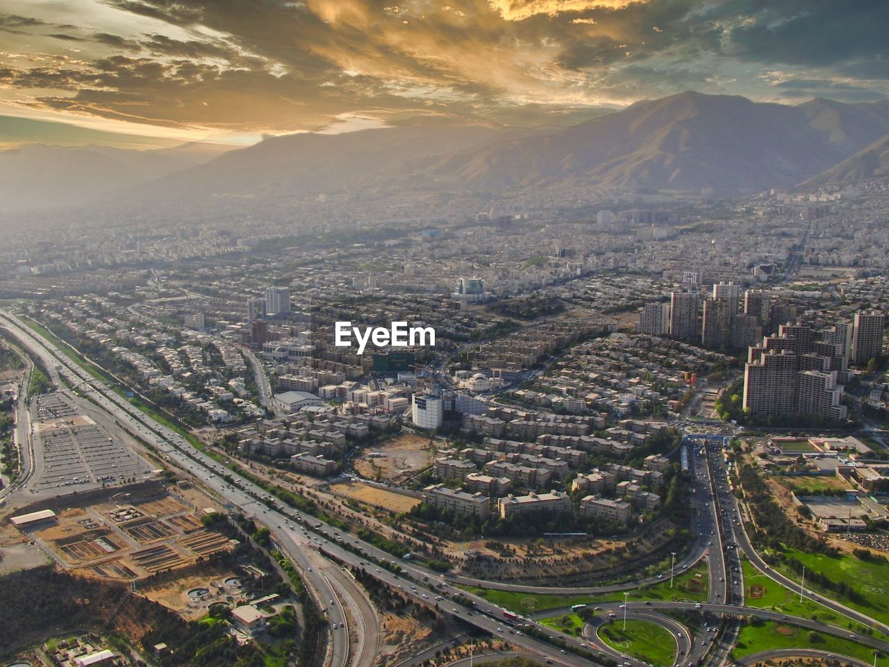 High angle view of city against sky during sunset