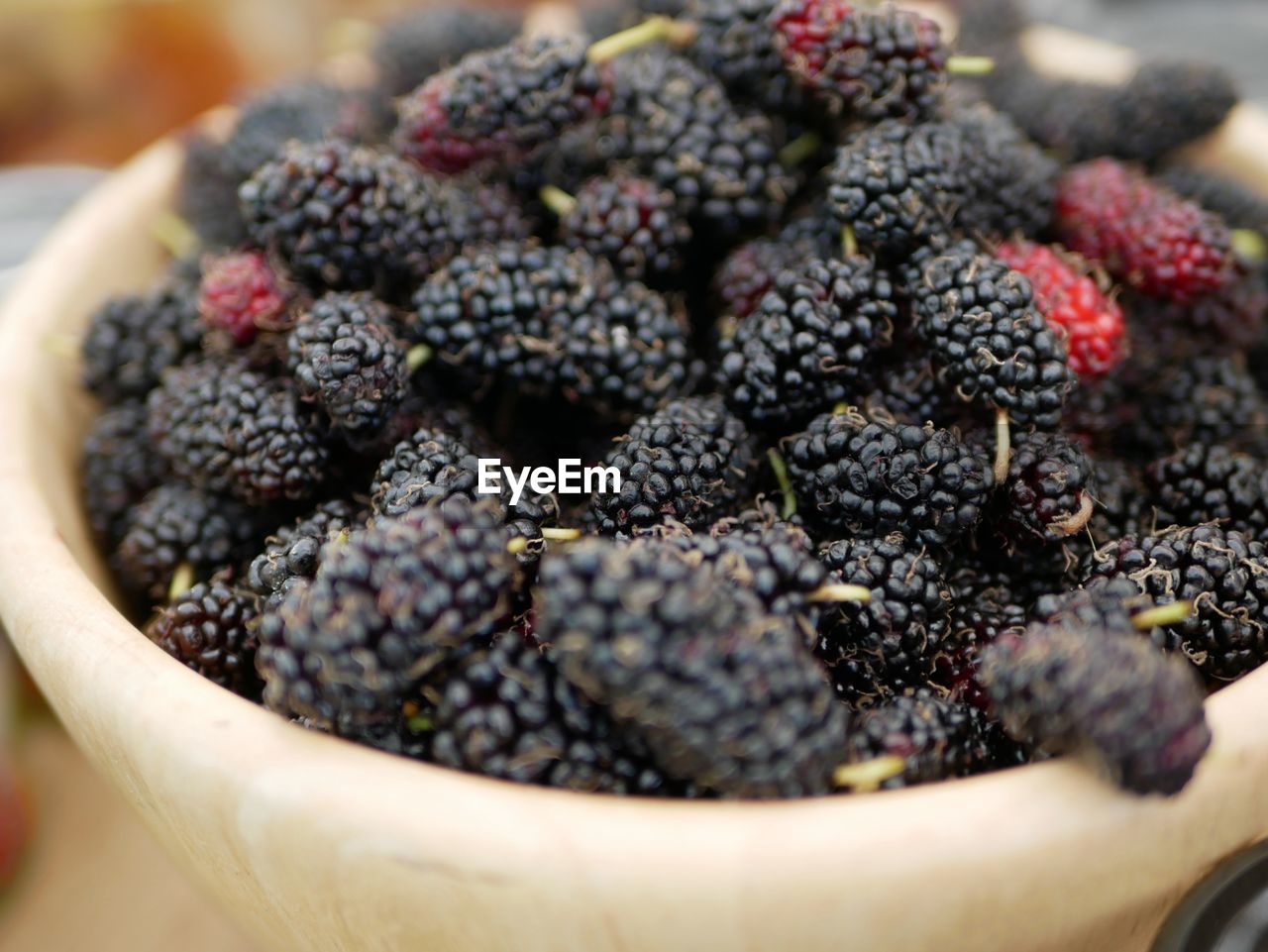 High angle view of berries in bowl on table