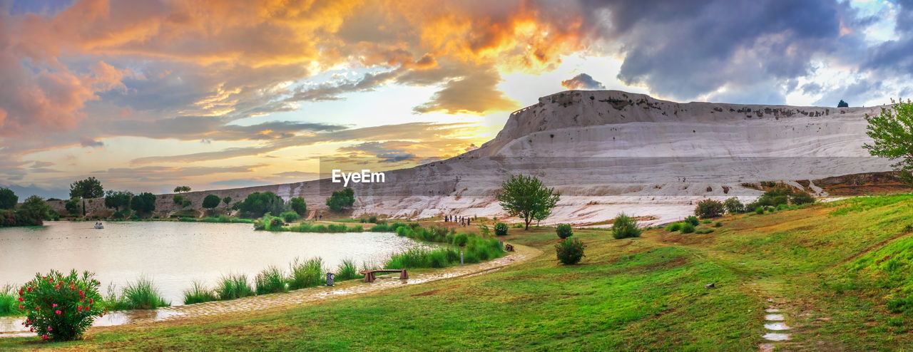 PANORAMIC VIEW OF LAKE AND MOUNTAINS AGAINST SKY