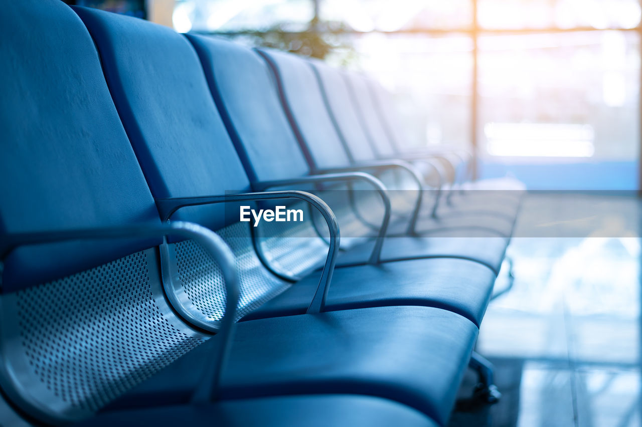 CLOSE-UP OF EMPTY SEATS IN ROOM