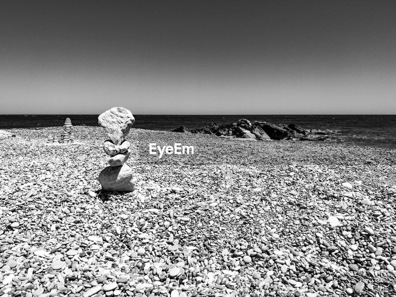 REAR VIEW OF WOMAN ON BEACH