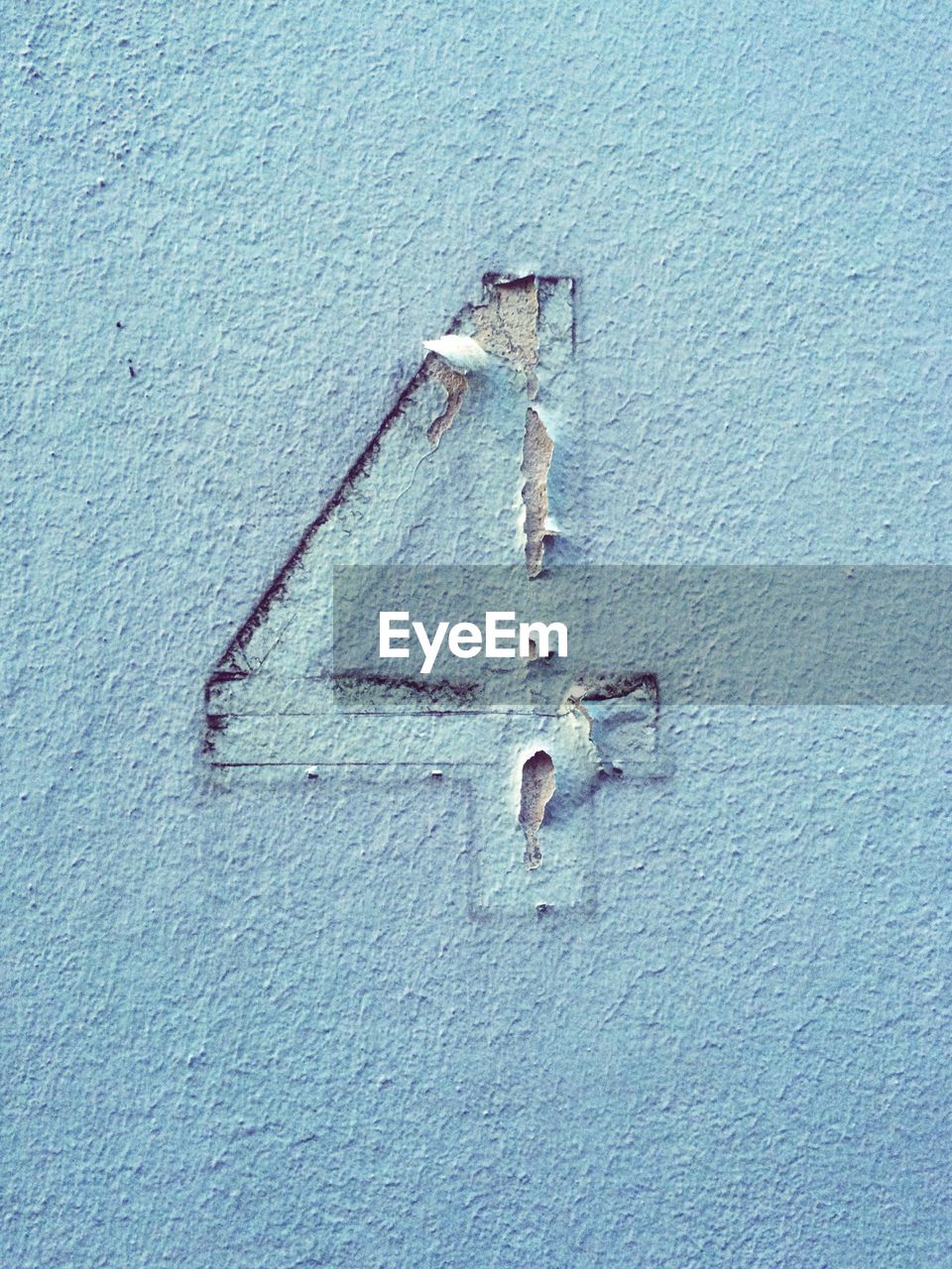 Detail shot of number 4 on wall