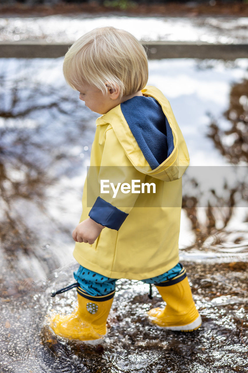 side view of boy playing with water