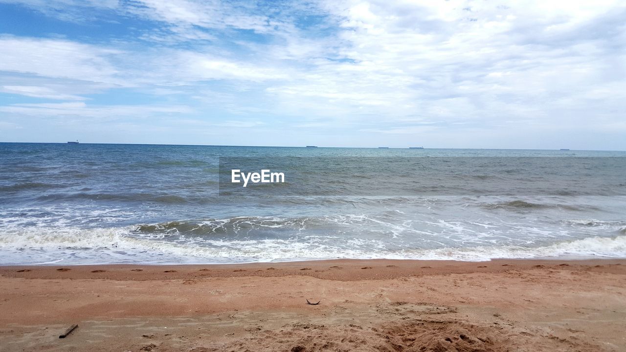 Scenic view of beach against sky