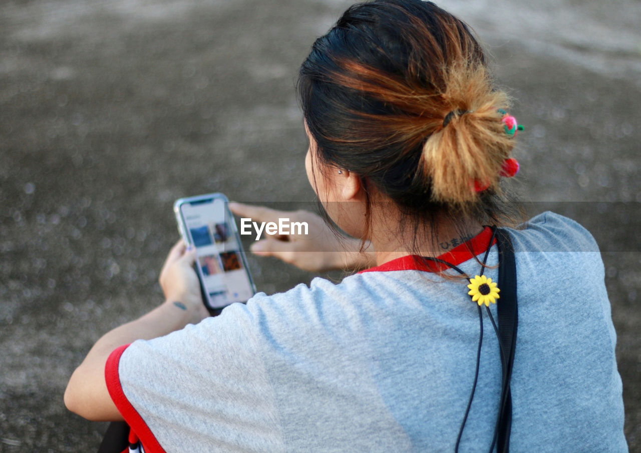 Young woman using mobile phone