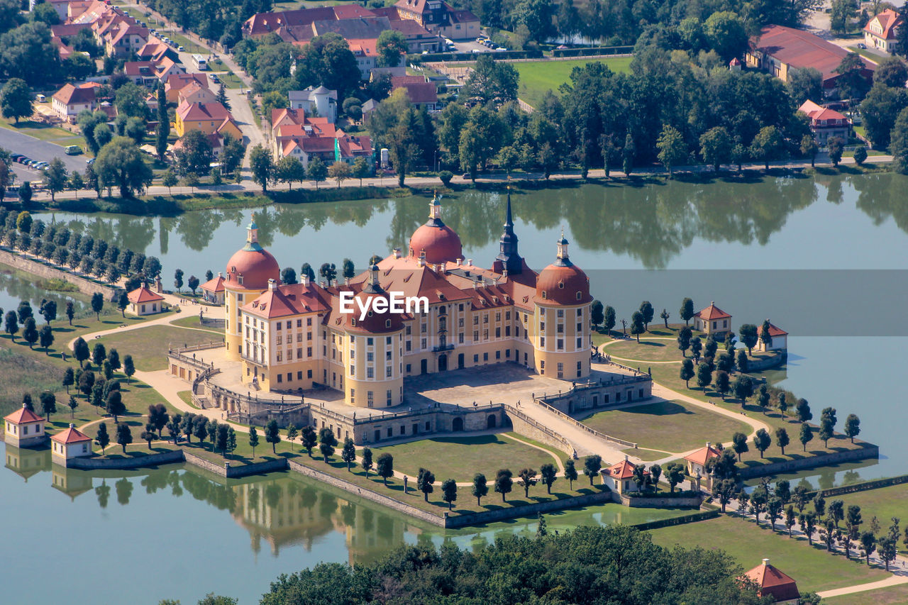 PANORAMIC VIEW OF BUILDINGS AND LAKE