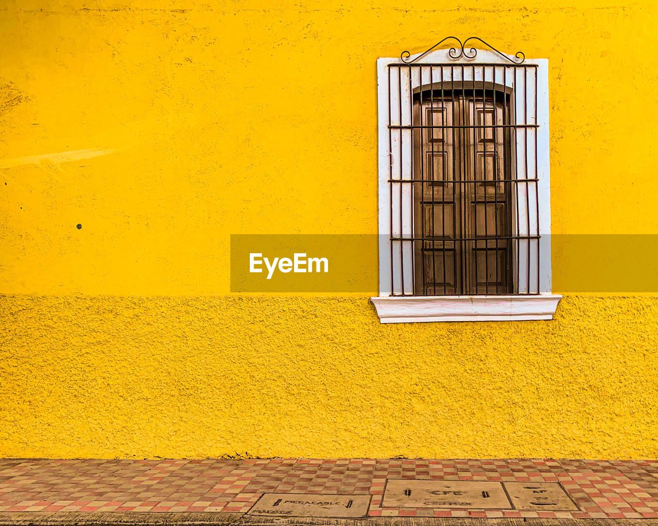 WINDOW OF YELLOW BUILDING