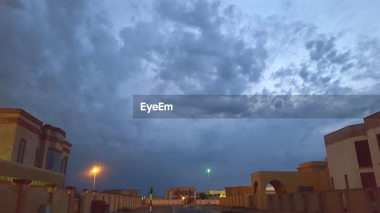 Low angle view of illuminated buildings against sky