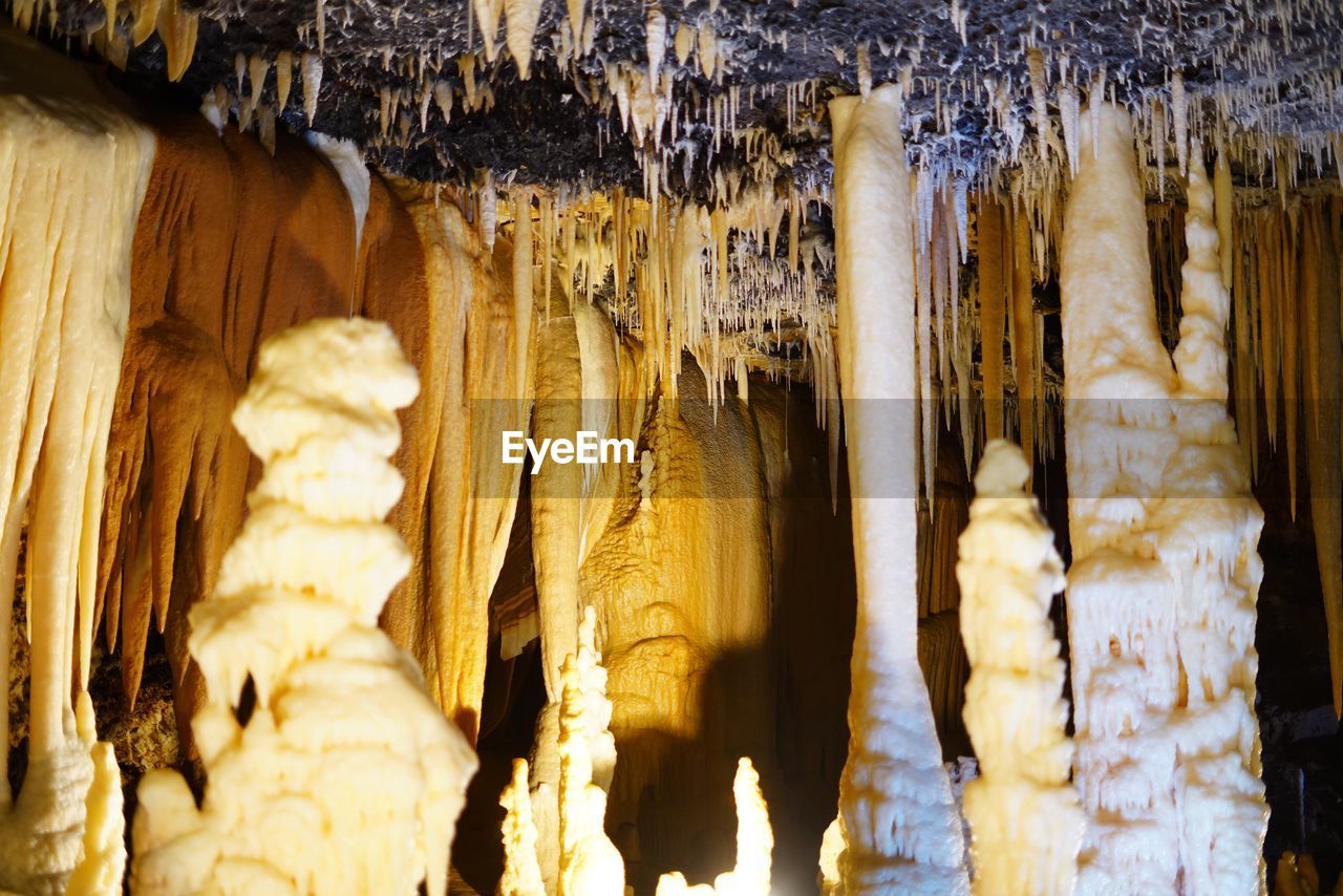 stalagmite, stalactite, speleothem, cave, geology, no people, rock, physical geography, nature, rock formation, beauty in nature, limestone, pattern, indoors, travel destinations, travel, low angle view
