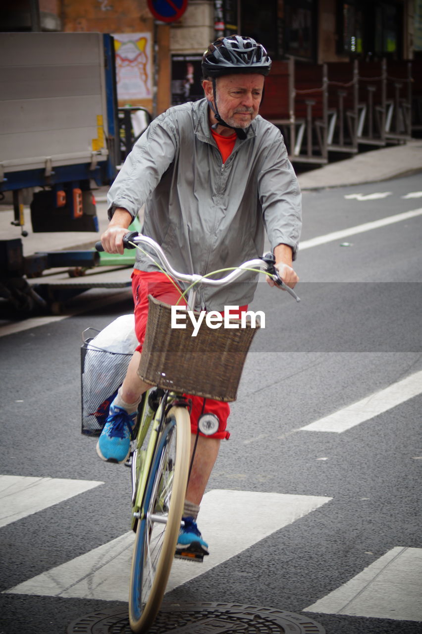 Man riding bicycle on road