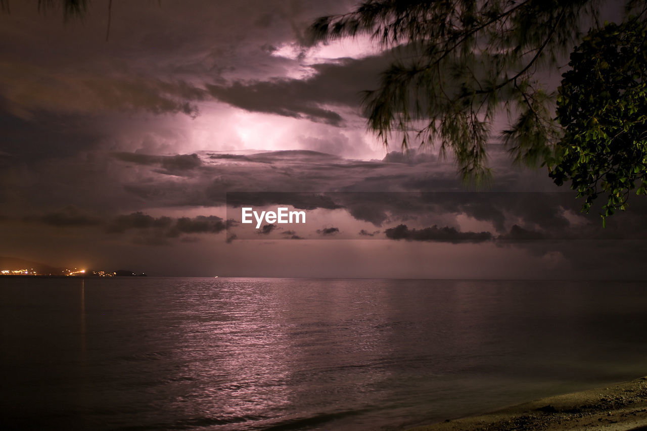 Scenic view of sea against sky during a thunderstorm with a lightning in the clouds in thailand