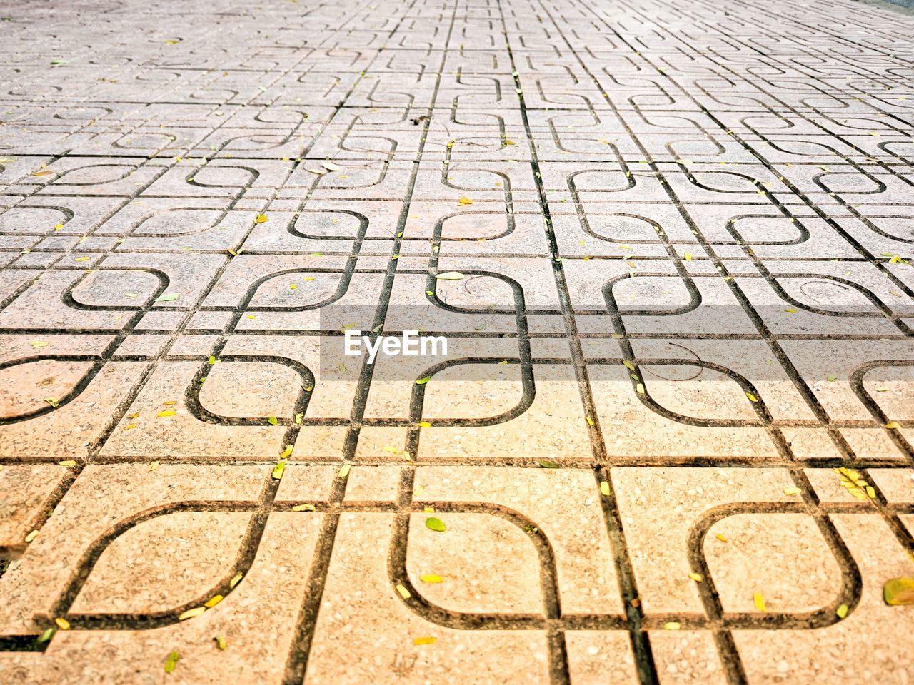 high angle view of man standing on footpath