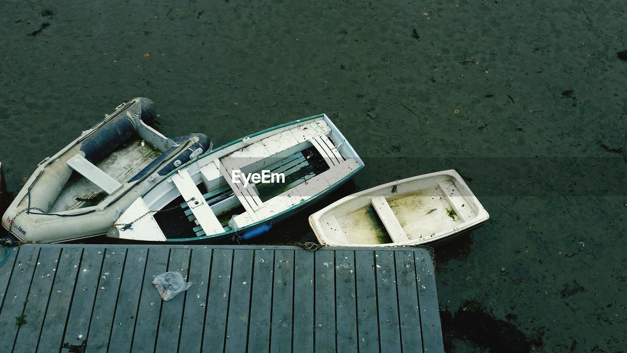 High angle view of boats moored at pier on lake