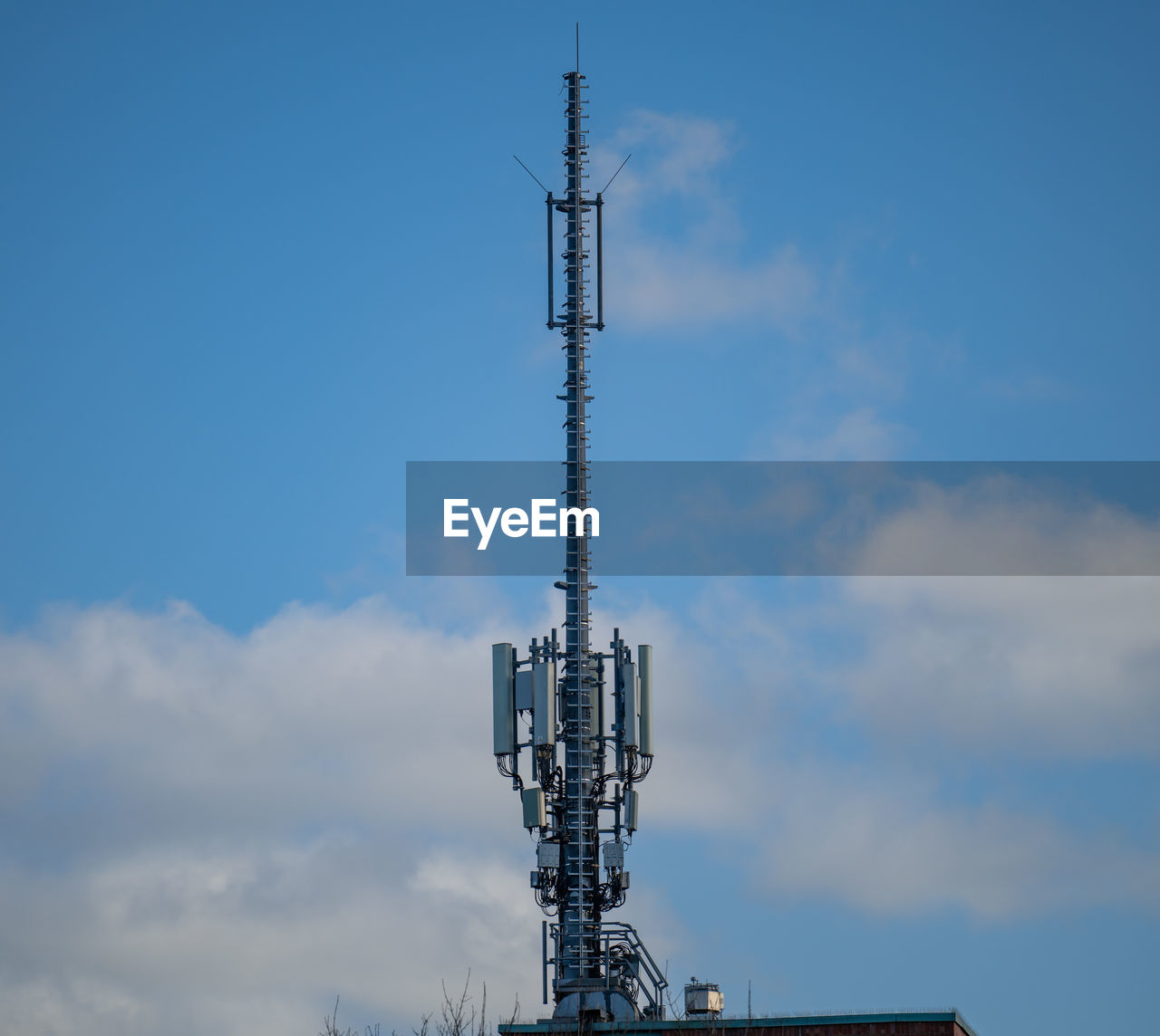 sky, technology, communications tower, broadcasting, cloud, built structure, architecture, tower, communication, satellite dish, wireless technology, global communications, satellite, antenna, telecommunications equipment, nature, no people, telecommunications engineering, low angle view, day, blue, metal, mast, outdoors, industry, transmission tower, copy space, power generation, overhead power line, electricity, steel, skyscraper