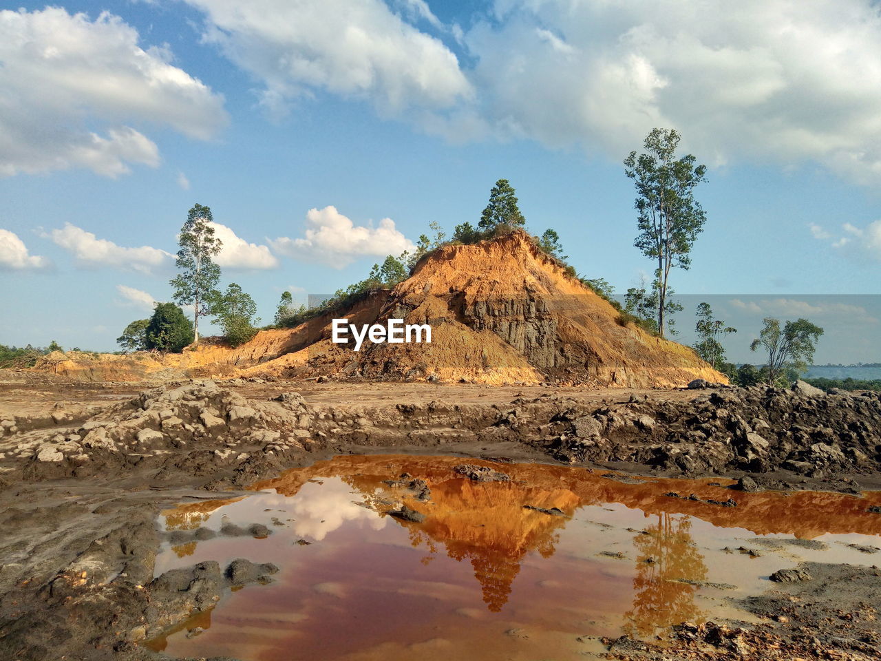 Rock formations on landscape against sky