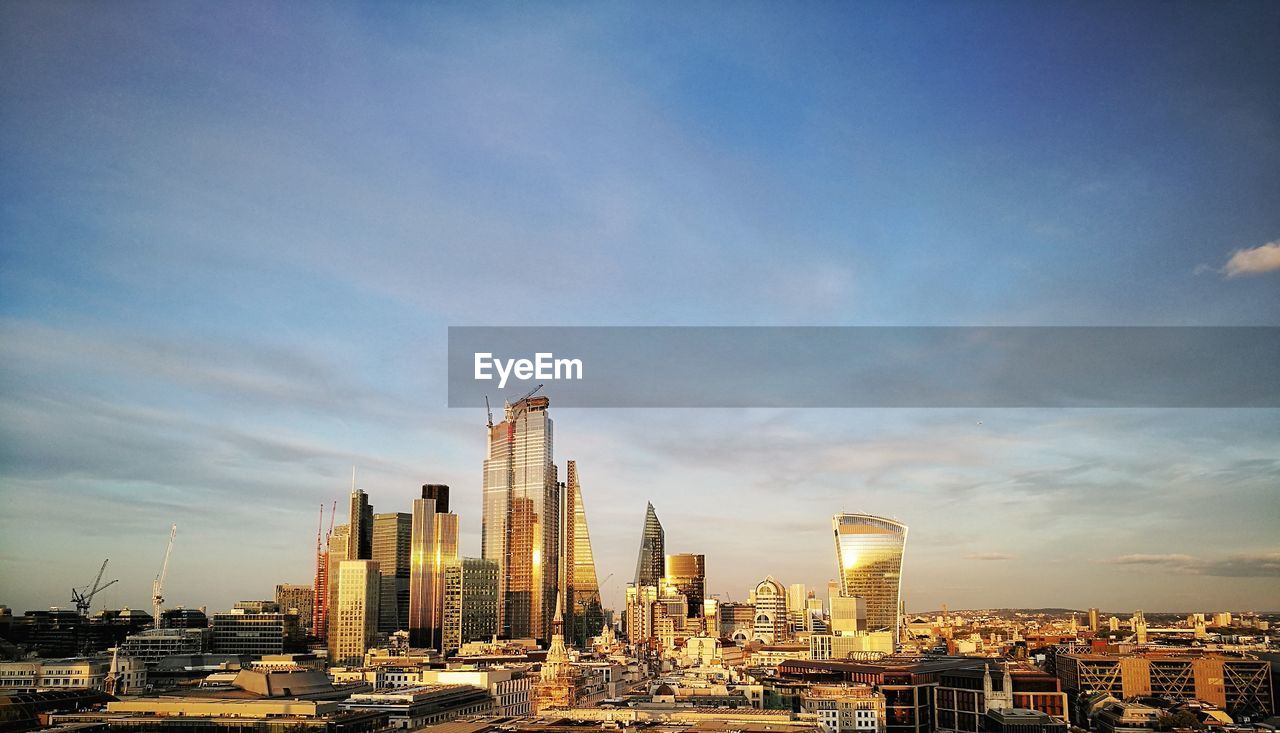 BUILDINGS IN CITY AGAINST SKY