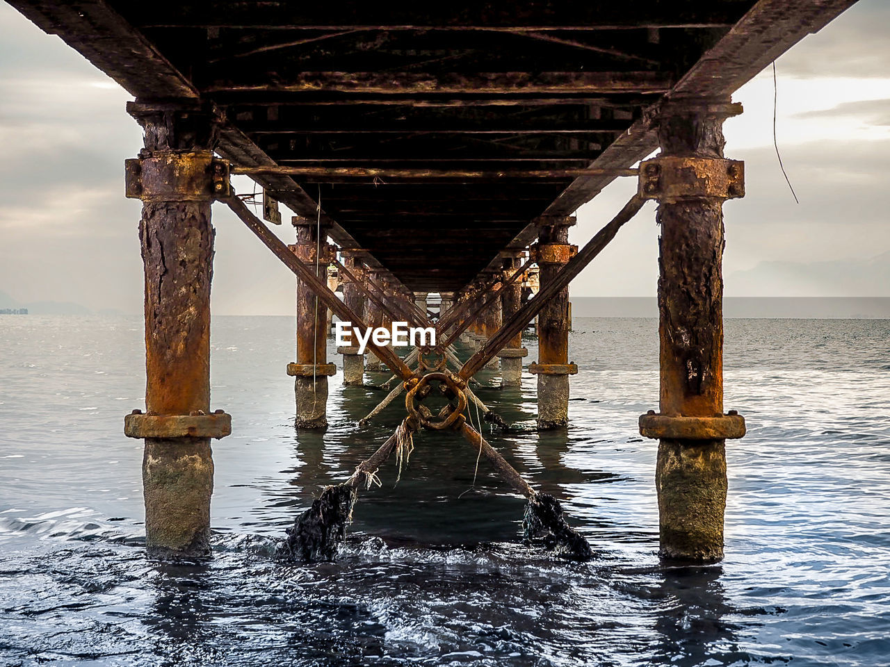 Pier over sea against sky